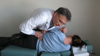 Dr. Gregg Hebeisen provides care to a patient