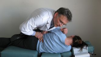 Woman receiving chiropractic care in Blaine